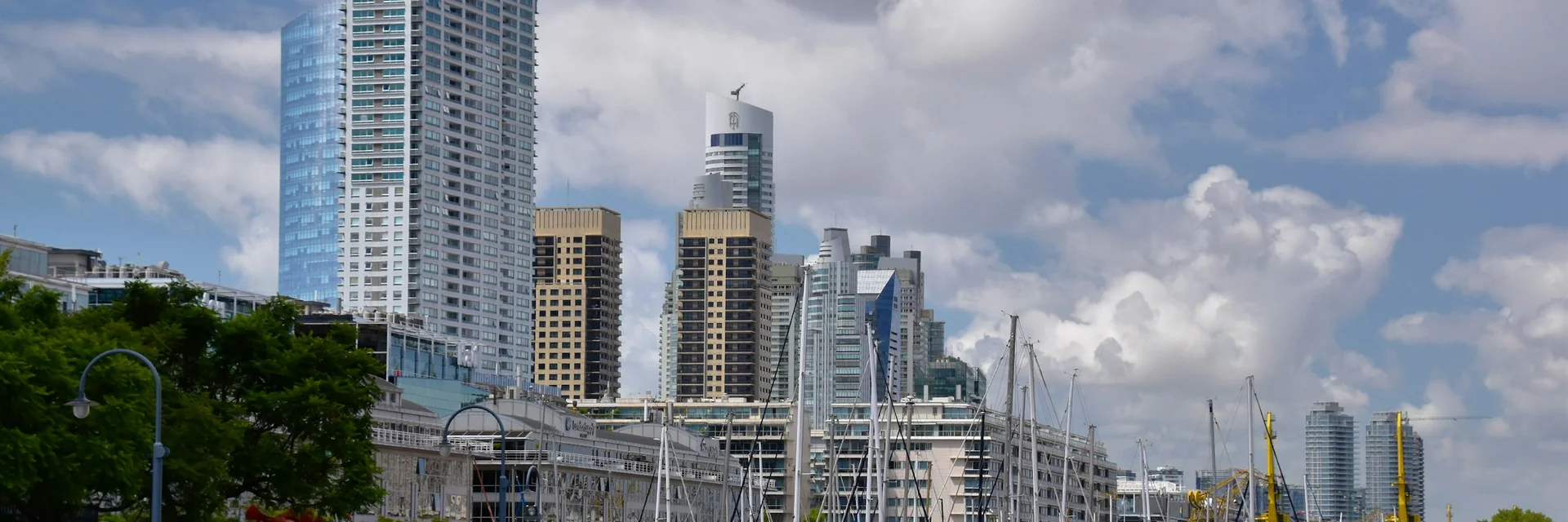 The high-rise towers and marina of Puerto Madero, Buenos Aires, seen from the docks in daylight (representative photograph of the neighbourhood, not Madero Tango's own building)